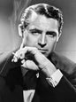 Photo Cary Grant en costume sombre et cigarette allumée - Années 1940 - 15x20